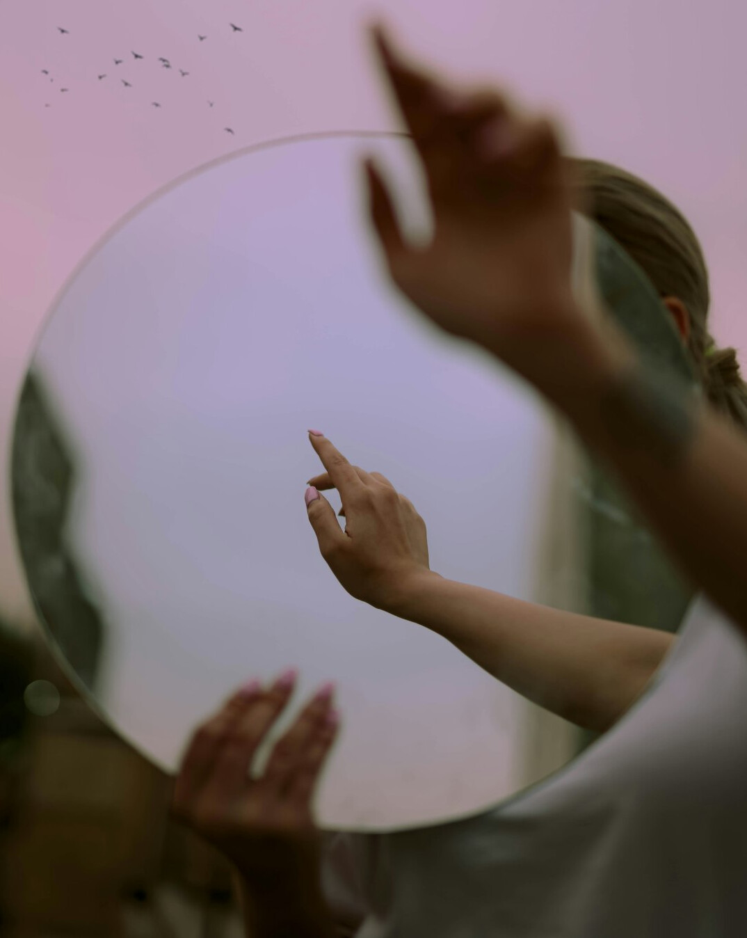 person reflecting in mirror