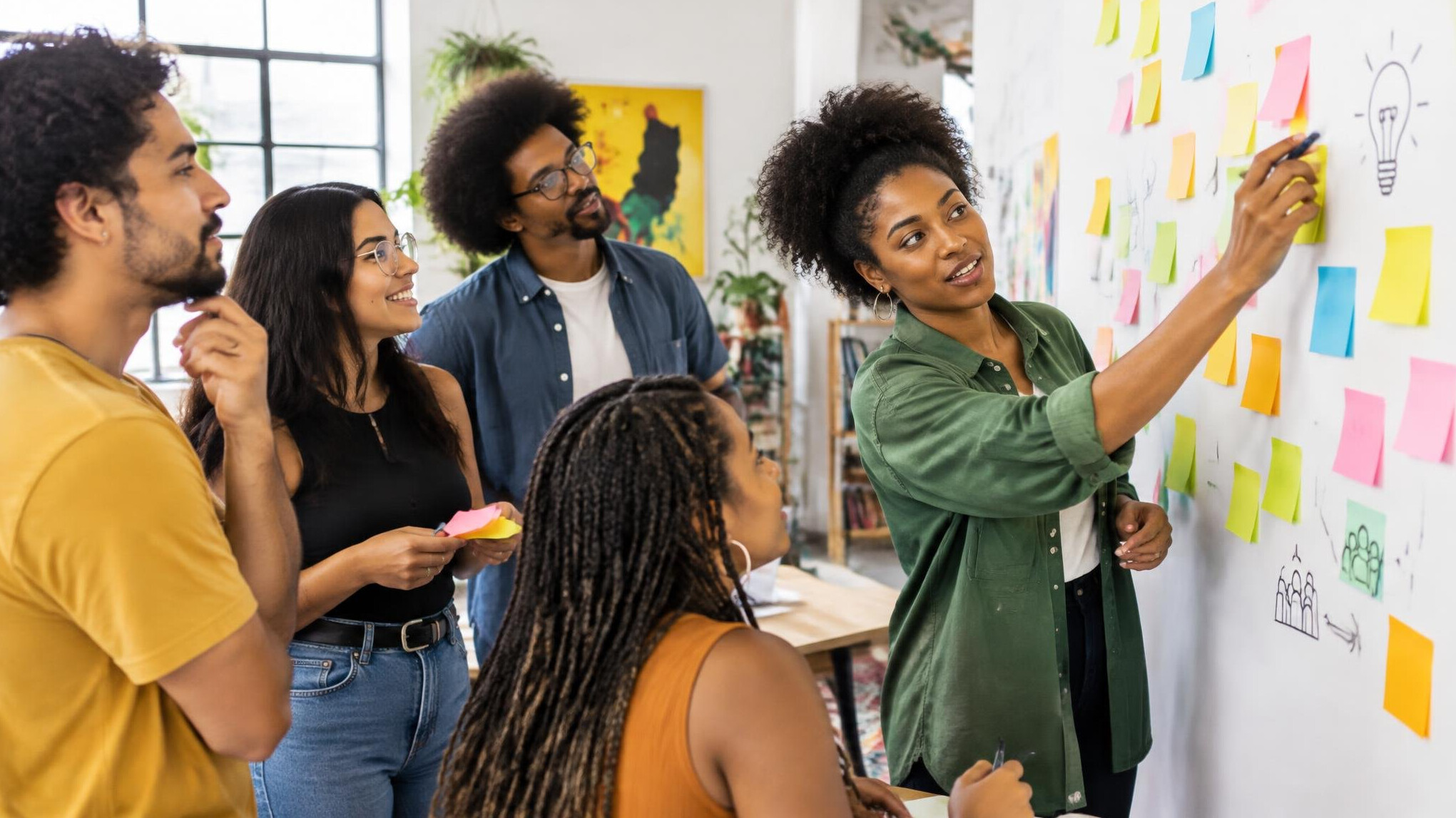 Team brainstorming with sticky notes on a wall