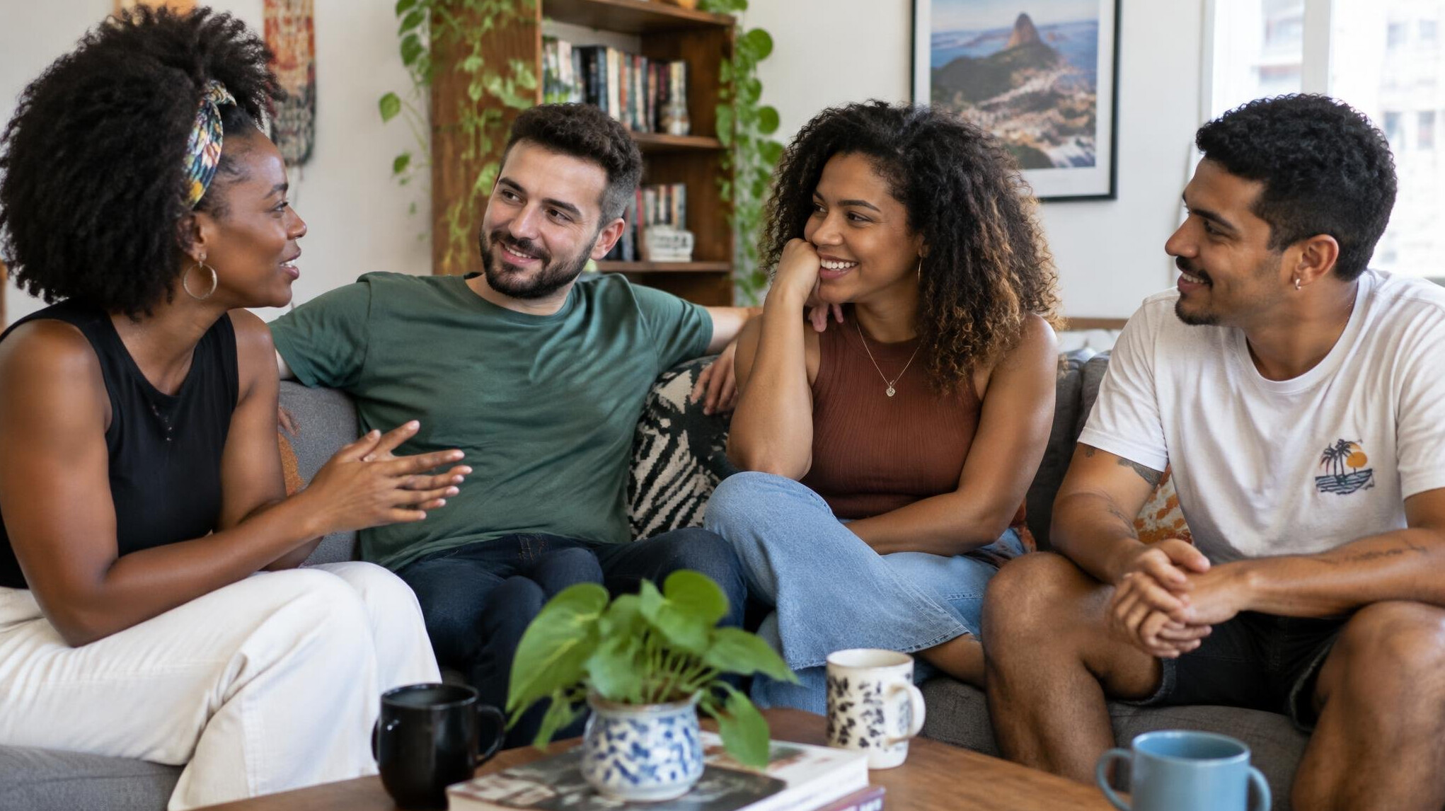 Friends having an engaged conversation indoors